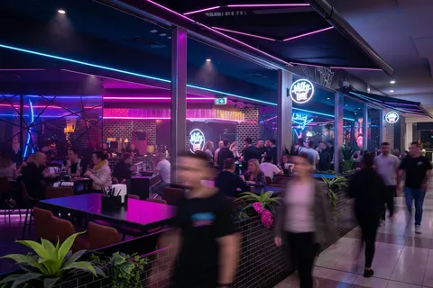 Milky Lane Southlands under pink neon