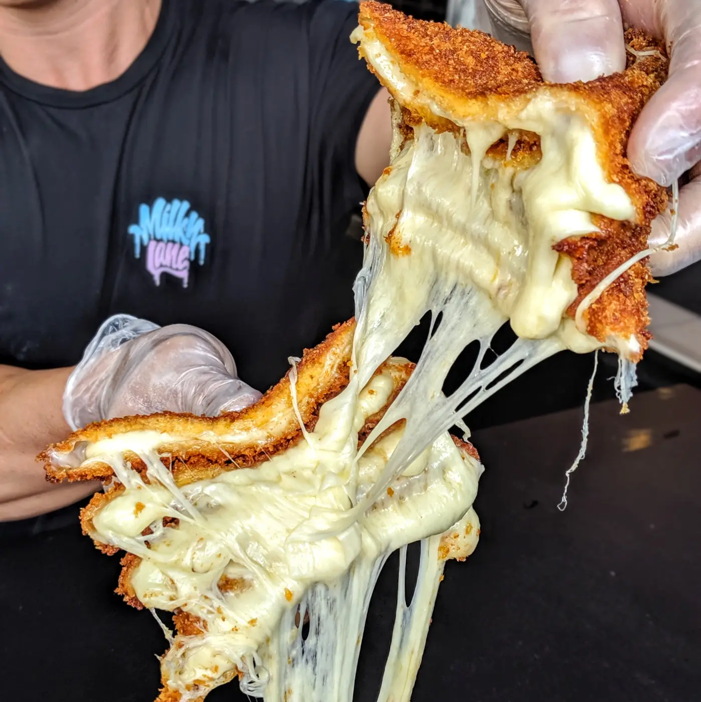 Milky Lane toastie with a long mozzarella cheese pull
